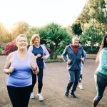 Group of sport senior people workout running outdoors at park city - Elderly community health