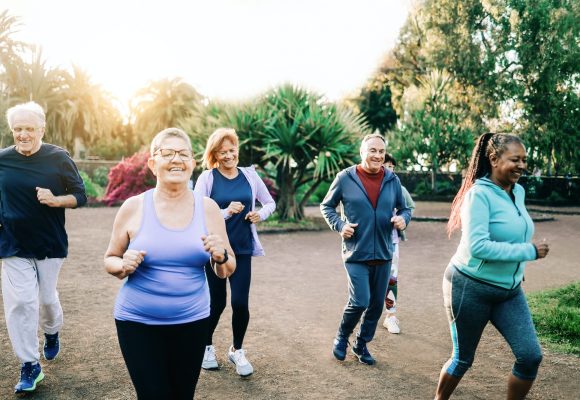 Group of sport senior people workout running outdoors at park city - Elderly community health