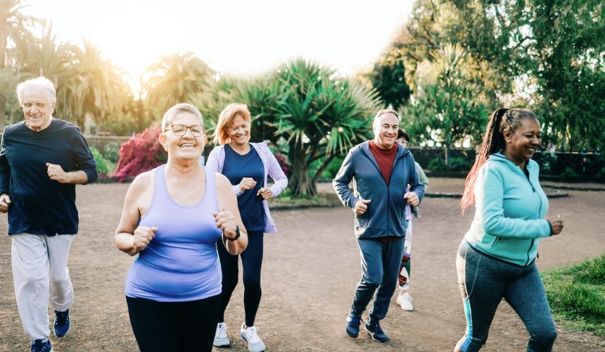 Group of sport senior people workout running outdoors at park city - Elderly community health